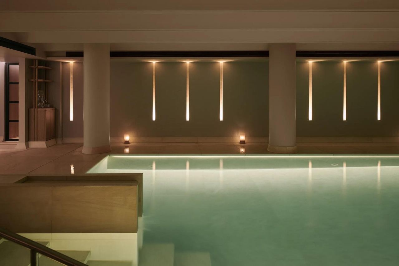 The softly lit pool at Claridge’s Spa, Mayfair