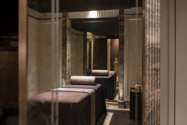 A double treatment room lined in marble at The Lanesborough Club & Spa