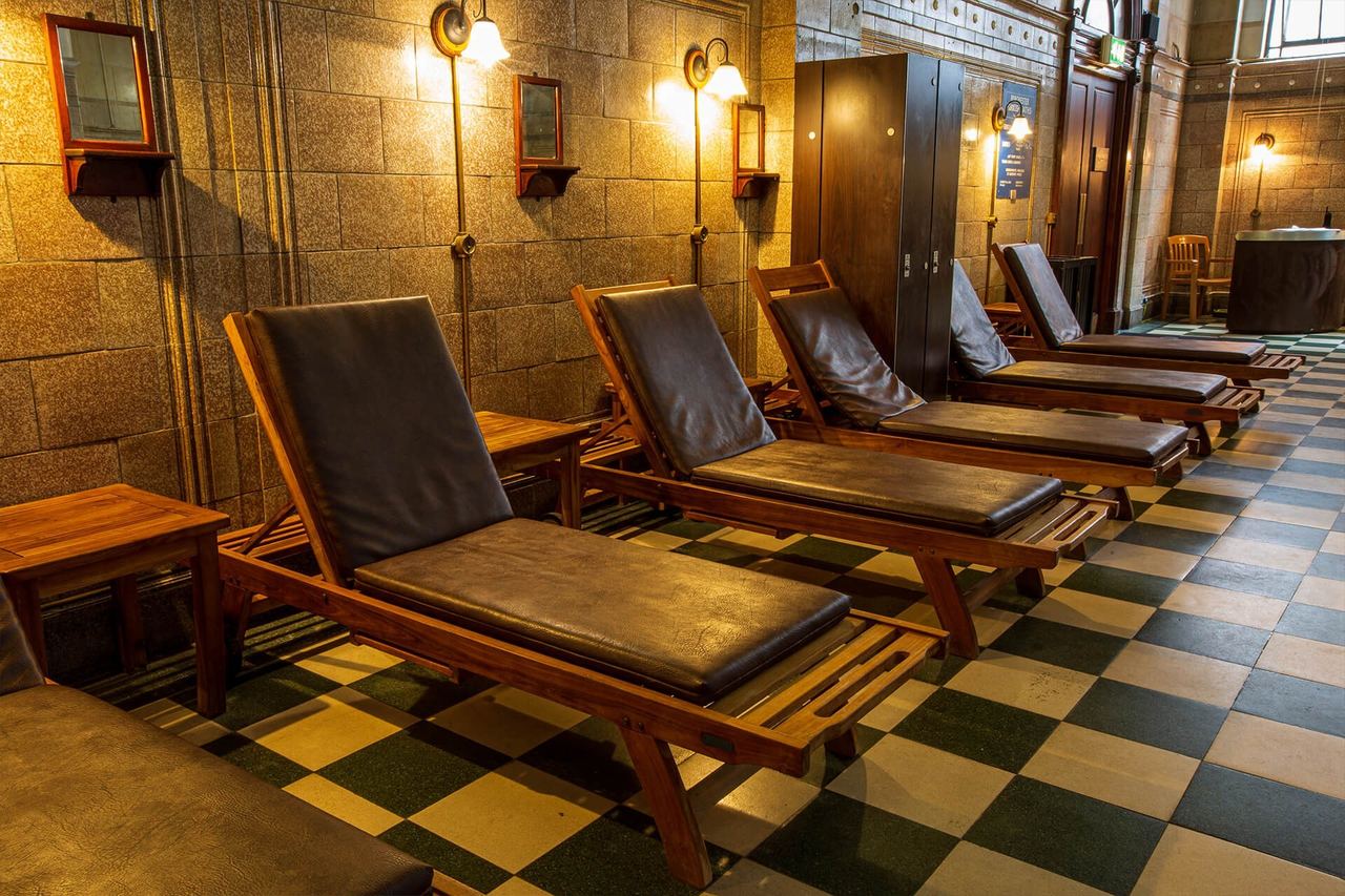 Leather loungers on the chequered floor of the Porchester Spa’s rest area