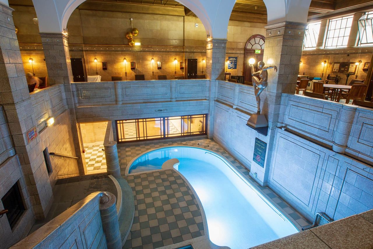The cold-water plunge pool and tiled bathing hall of the Porchester Spa, Bayswater