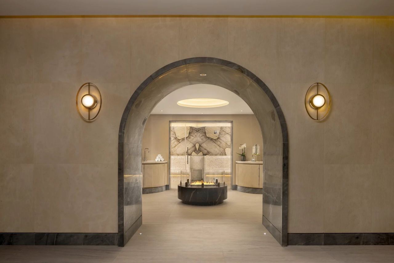 A stone archway into the thermal suite at Guerlain Spa, Raffles London at The OWO